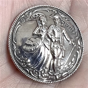 Hallmarked silver button of man and woman walking with umbrella and cane. 
