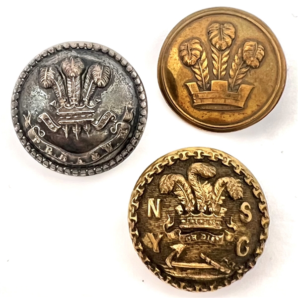 Three metal buttons of the Prince of Wales feathers.