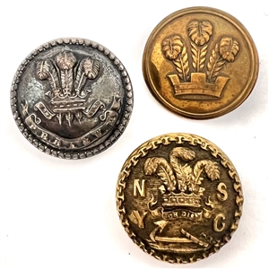Three metal buttons of the Prince of Wales feathers.