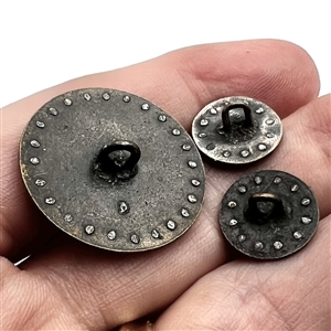 Three painted enamel buttons of architectural scenes.