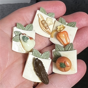 Set of five Weeber Vintage celluloid buttons of fruit and vegetables. 
