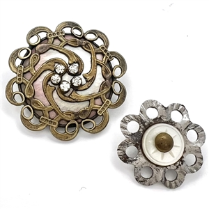 Two pearl and metal buttons. 