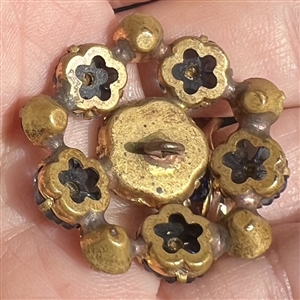 Pretty jewel button of multicolored flowers and pastes.