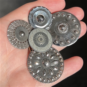Four Steel buttons and One white metal button. 