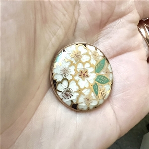 Modern Satsuma button of a white cherry blossoms.