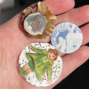 Three fun studio buttons.