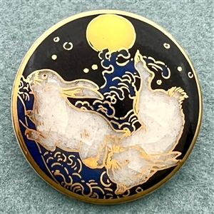 Modern Satsuma button of two rabbits under a full moon.