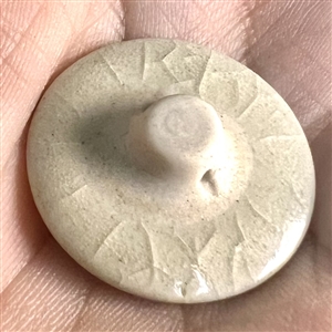Modern Satsuma button of two rabbits under a full moon.