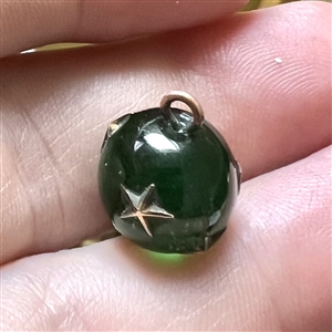 RARE green glass ball button with impression inlay metal stars.