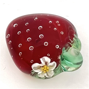 Mary Gaumond's torch-worked glass studio button of a realistic strawberry.