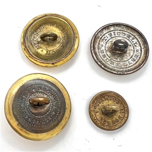 Four livery buttons of hands holding things.
