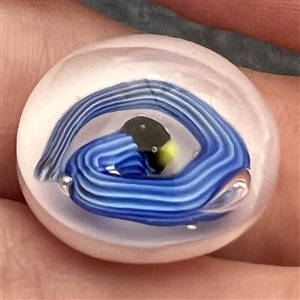 Studio glass paperweight button of a snake.