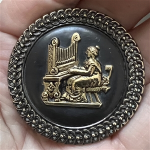 SCARCE brass button of St. Cecilia at the organ.