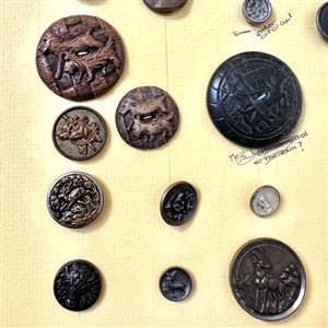Card of twenty nine buttons of assorted animals.