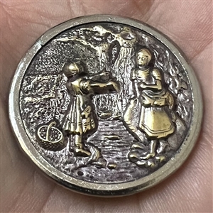Brass button of “Crossing the stream.