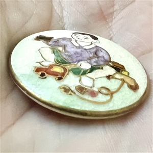 Satsuma button of Japanese boy playing with toys.