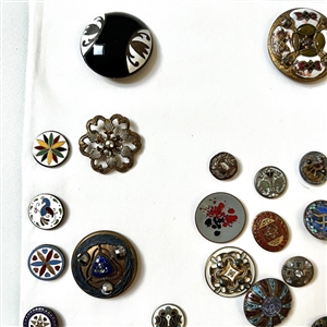 Card of forty four mostly enamel buttons.