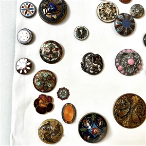 Card of forty four mostly enamel buttons.