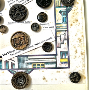 Card of twenty five mostly architectural buttons.