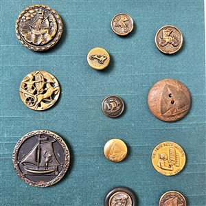 Card of twenty eight mostly transportation buttons.
