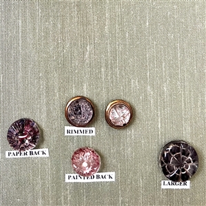 Card of twenty three glass kaleidoscope buttons.