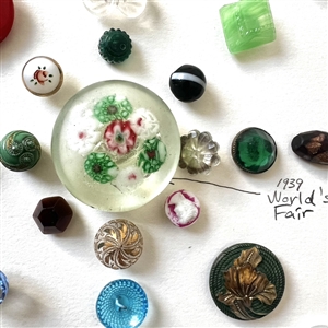 Card of thirty nine assorted glass buttons.