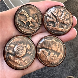 Four iron wood and copper studio buttons by Ralph Briggs.
