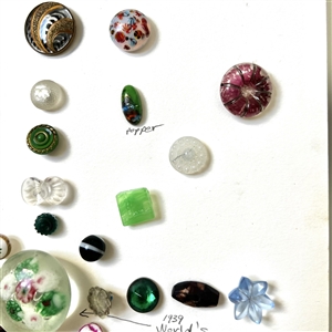 Card of thirty nine assorted glass buttons.