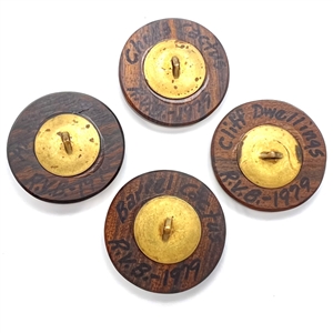 Four iron wood and copper studio buttons by Ralph Briggs.