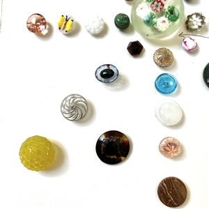 Card of thirty nine assorted glass buttons.