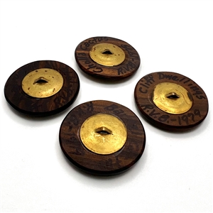 Four iron wood and copper studio buttons by Ralph Briggs.