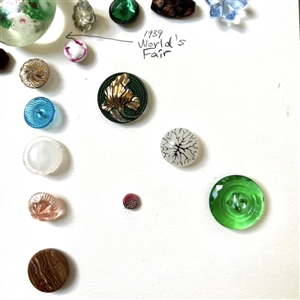 Card of thirty nine assorted glass buttons.