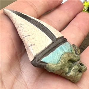 Ceramic studio button of a sail boat.