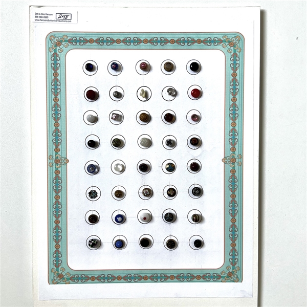 Card of forty diminutive glass buttons.
