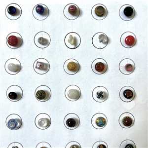 Card of forty diminutive glass buttons.