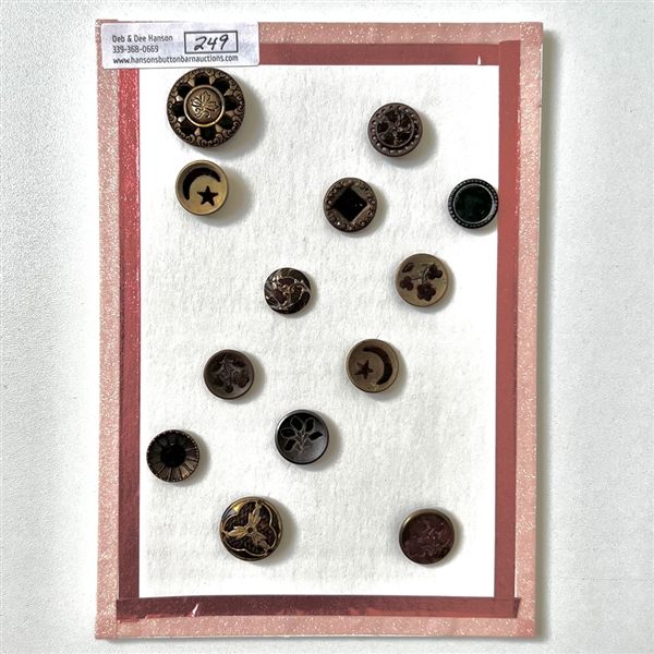Card of thirteen perfume buttons. 