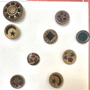 Card of thirteen perfume buttons. 