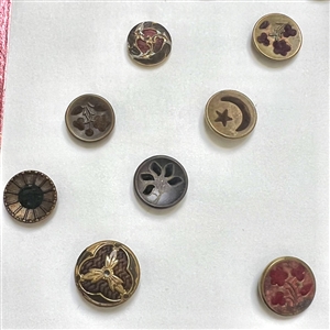 Card of thirteen perfume buttons. 