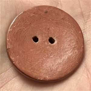 Zia pueblo button of a flower.