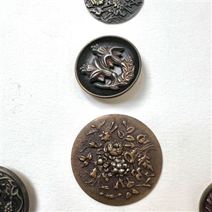 Card of twenty six buttons of plant life.