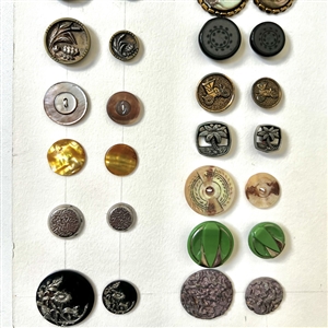 Card of twenty eight matching pairs of buttons.