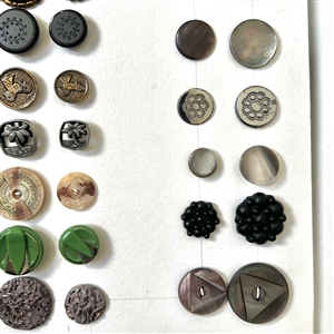 Card of twenty eight matching pairs of buttons.