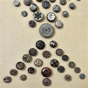 Two cards of ninety seven black glass buttons.