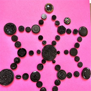 Two cards of ninety seven black glass buttons.