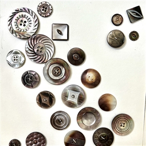 Two cards of fifty eight shell buttons. 