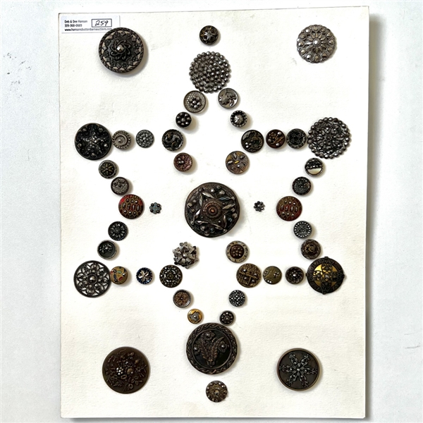 Card of forty nine metal buttons with steel OME. 
