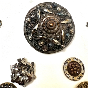 Card of forty nine metal buttons with steel OME. 
