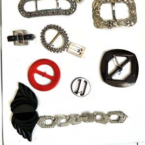 Two cards of buttons and buckles, two of which are 19th c. shoe buckles.