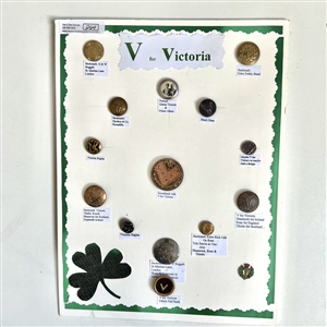 Card of fifteen “V" for Victoria buttons.