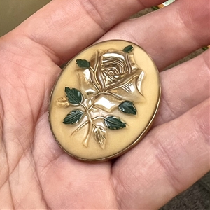 Caramel glass button of a rose.